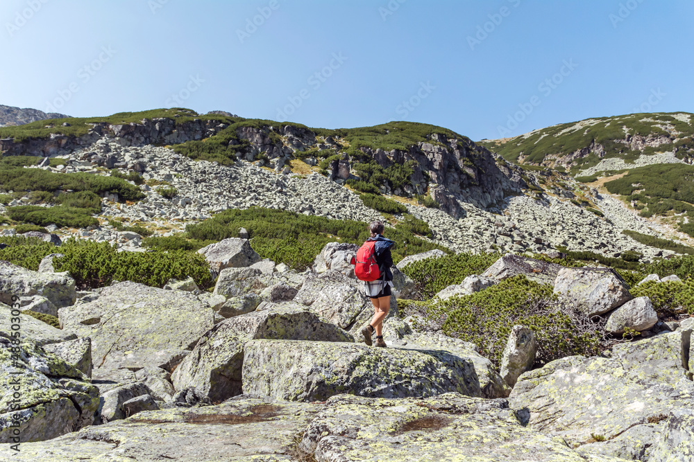 Hiker Woman in Rila Mountain with Stunning View. Musala Peak in Bulgaria in the Summer 