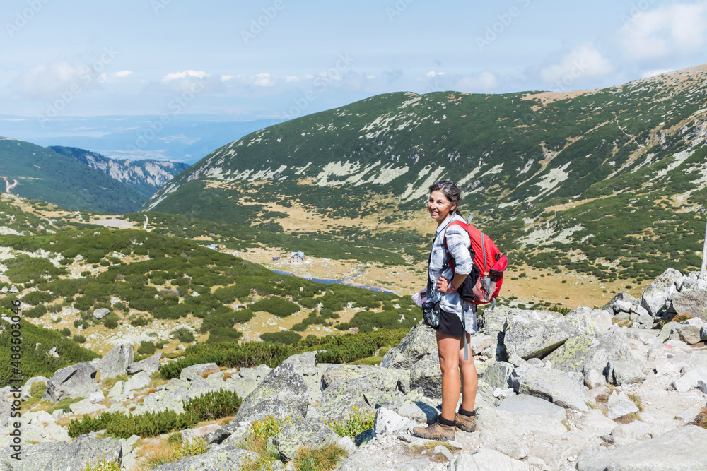 Hiker Woman in Rila Mountain with Stunning View. Musala Peak in Bulgaria in the Summer 