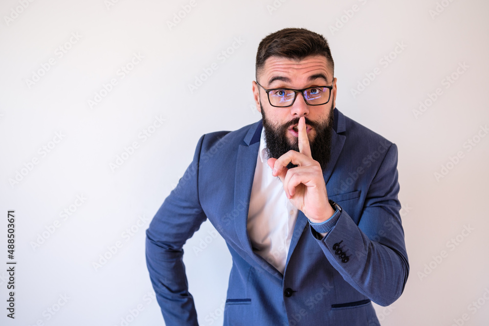 Portrait of businessman who wants silence. Copy space on image for your text or advert. Portrait of businessman who wants silence. Copy space on image for your text or advert.