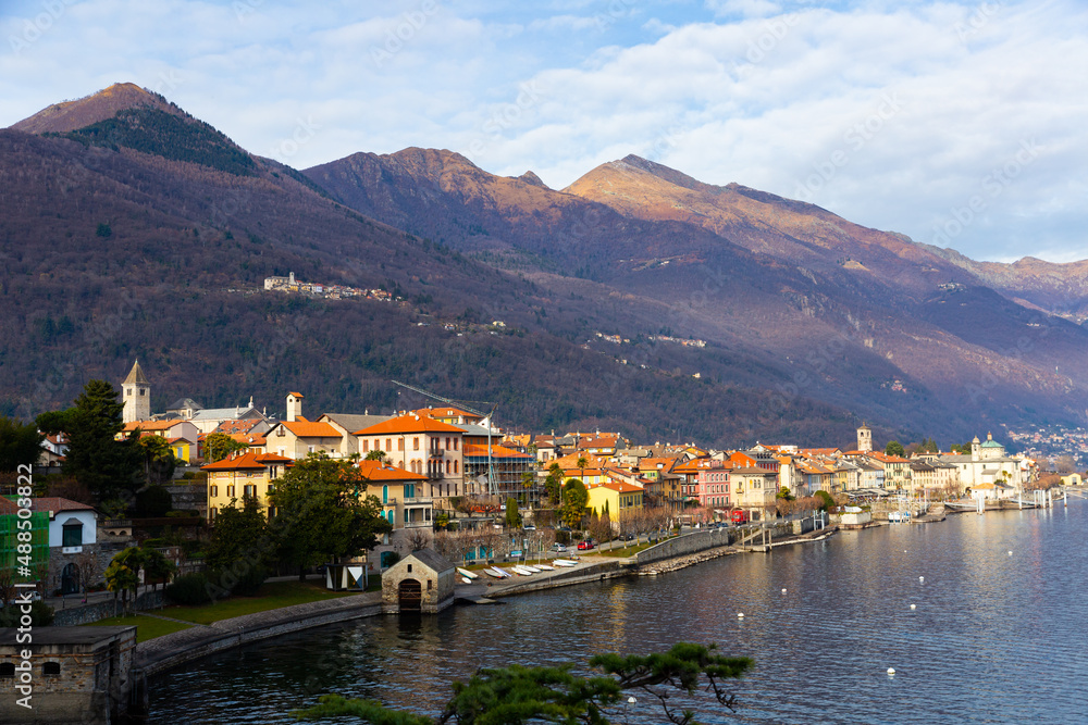 Houses along Lake Maggiore with view of mountains in Cannobio, Italy.