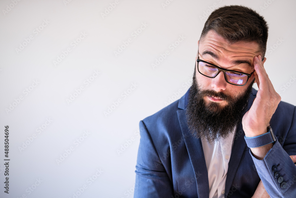 Portrait of businessman who is having headache. Copy space on image for your text or advert. Portrait of businessman who is having headache. Copy space on image for your text or advert.