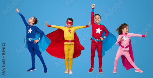 Little superheroes in different poses photo