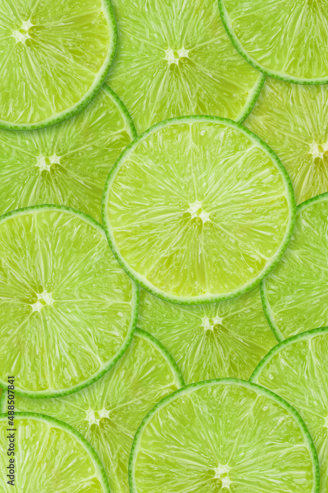 Fruit pattern of lime slices background. Top view.