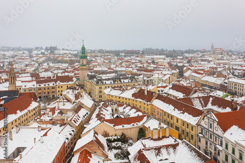 Aerial view about the iconic Fire tower and downtown of Sopron city. Snowy rooftops, winter cityscape photo