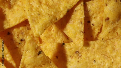 Rotation macro nacho chips, Background of Corn Tortilla Chips or Nachos, top view