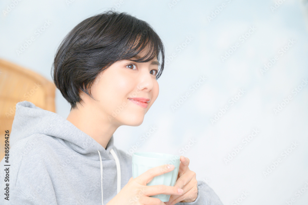 Close-up of a person working at home with a laptop, overhead view Close-up of a person working at home with a laptop, overhead view