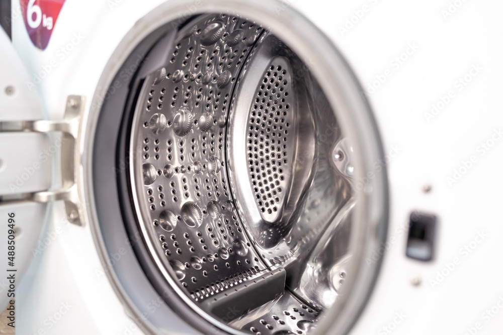 Drum of washing machine dry and clean close-up. Washing Dryer Machine inside view of a drum. Drum of washing machine dry and clean close-up. Washing Dryer Machine inside view of a drum.