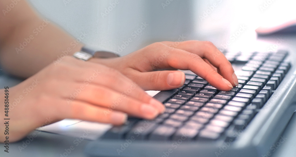 Close-up Of Female Hand Typing On Keyboard. Close-up Of Female Hand Typing On Keyboard.