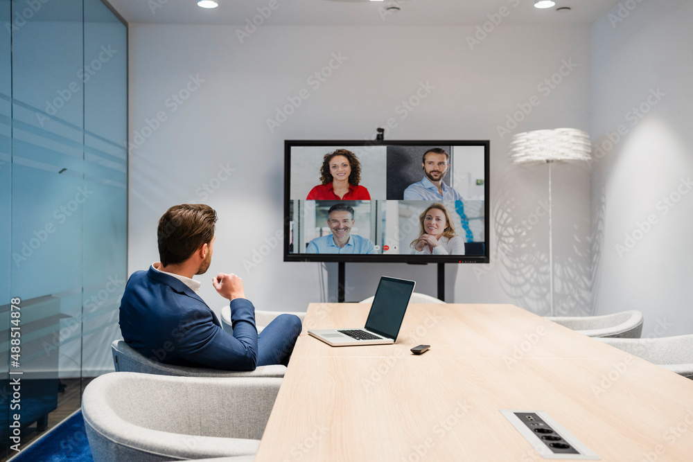 © Westend61 - Businessman discussing in web conference at meeting room