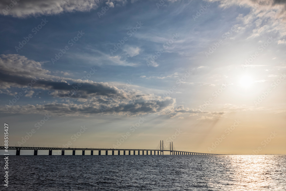 Sound strait at sunset with silhouette of Oresund Bridge in background Sound strait at sunset with silhouette of Oresund Bridge in background