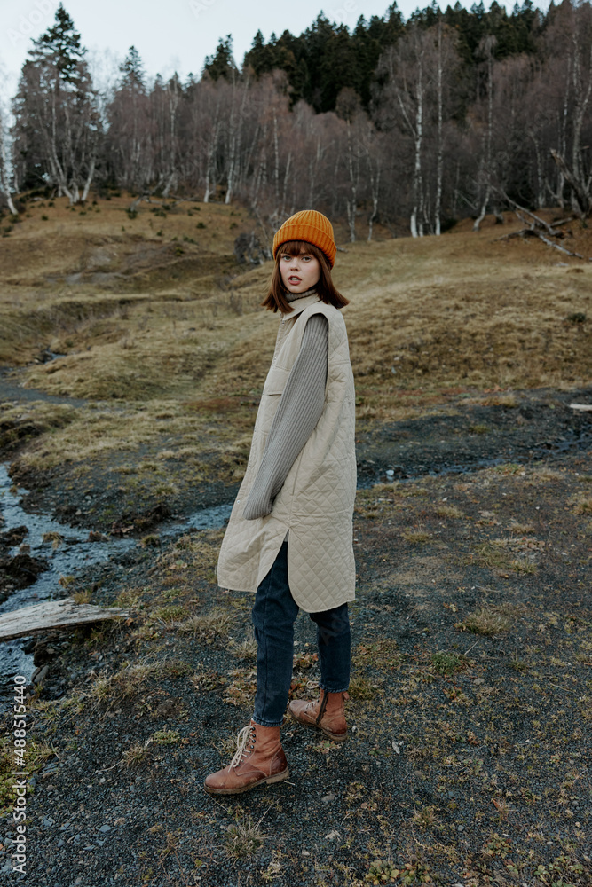 Naklejka premium young woman trees without leaves travel fresh air landscape