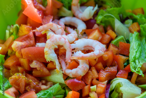 fresh summer salad of lettuce, tomato, cucumber and shrimps