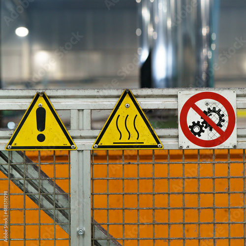 Old industrial safety sign. Warning safety sign inside a factory