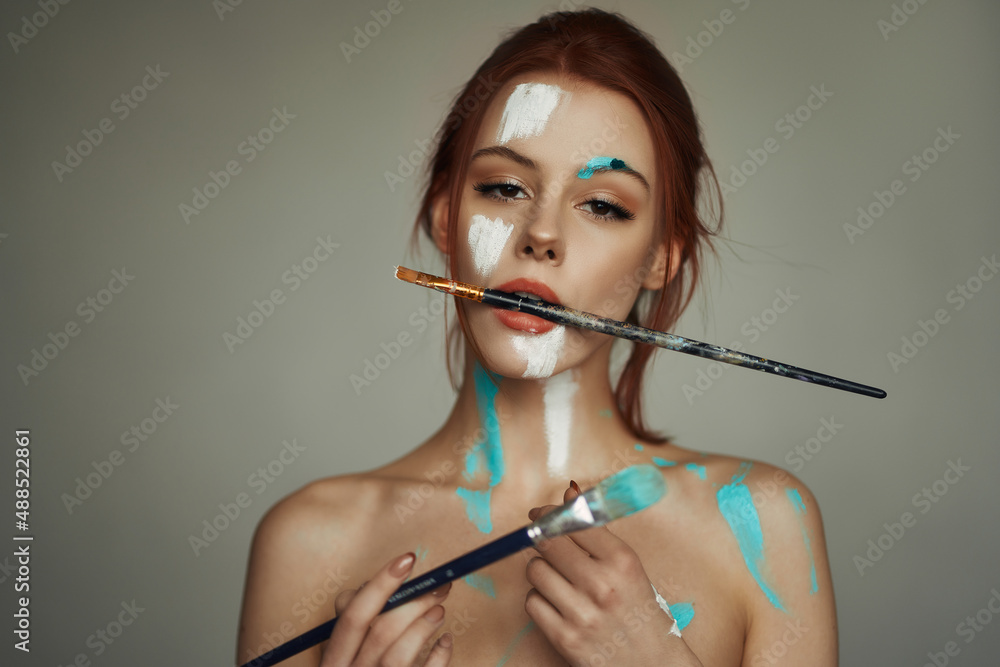 Beautiful girl on the bed. natural light. Photoshoot with paints. Beautiful girl on the bed. natural light. Photoshoot with paints.