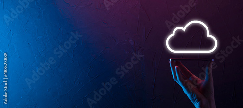 Hand holding icon cloud computing network and icon connection data information in hand. Cloud computing and technology concept.