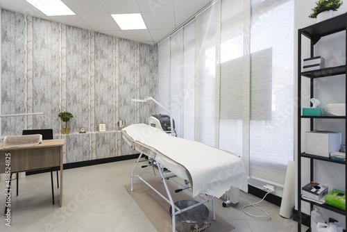Empty skin care treatment room at aesthetic clinic photo