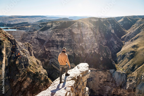 Man standing on mountain on sunny day photo