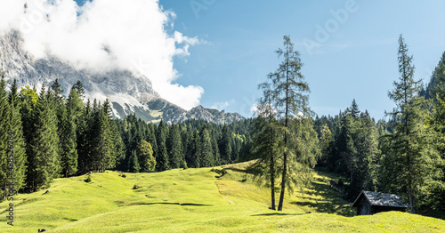 Alpine meadow in summer with Zugspitze mountain in background photo