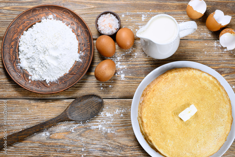 Ingredients for batter - flour, eggs, sugar, salt, milk. Pancakes with butter Ingredients for batter - flour, eggs, sugar, salt, milk. Pancakes with butter