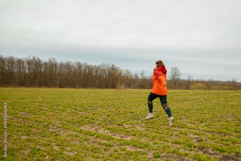 Overweight young athlete jogging in the forest. at the park. Fitness healthy lifestyle concept. Overweight young athlete jogging in the forest. at the park. Fitness healthy lifestyle concept.