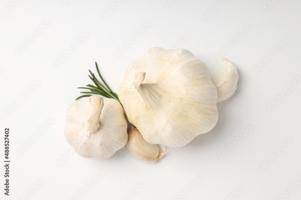 Garlic with rosemary on white background, close up Garlic with rosemary on white background, close up