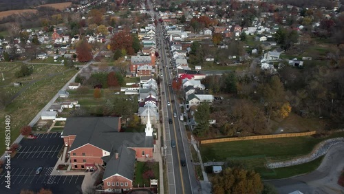 Boonsboro Maryland USA. Aerial View of Main Street Traffic and Mount Nebo United Methodist Church in Autumn Season, Drone Shot photo