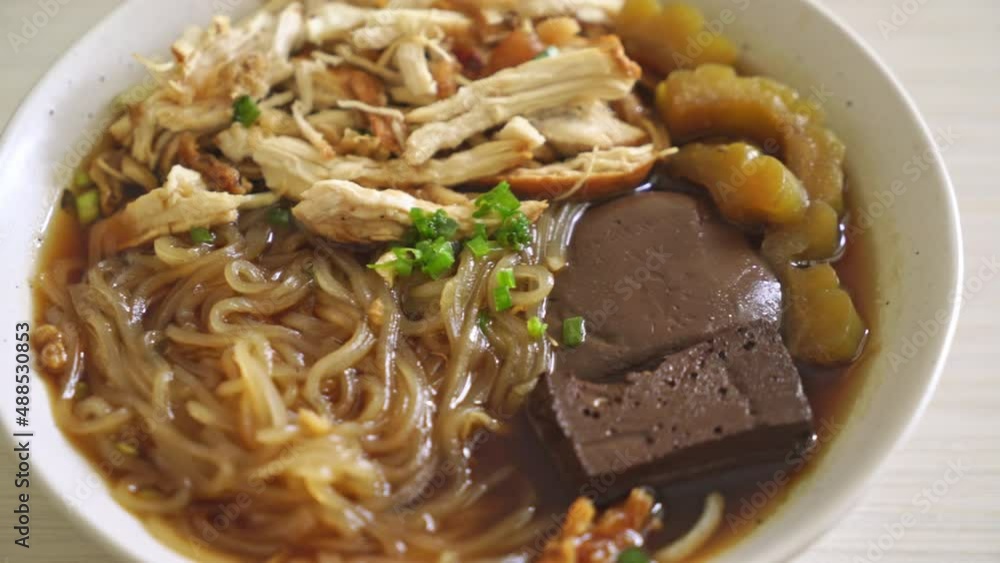 Stewed Chicken Noodle in Brown Soup Bowl - Asian food style Stewed Chicken Noodle in Brown Soup Bowl - Asian food style
