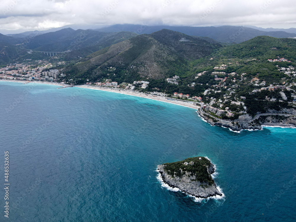 Fototapeta premium Aerial view of Bergeggi island, heart island from above, in Liguria, north Italy. Drone photography of the Ligurian coast, province of Savona with Spotorno and the island of Bergeggi.