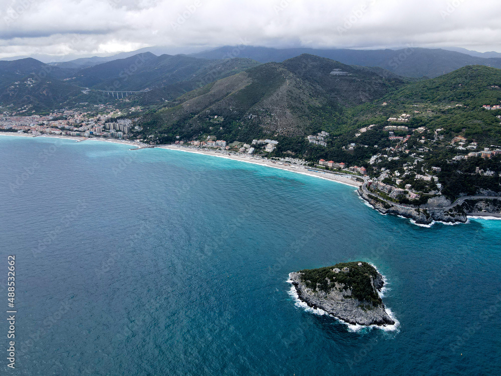 Fototapeta premium Aerial view of Bergeggi island, heart island from above, in Liguria, north Italy. Drone photography of the Ligurian coast, province of Savona with Spotorno and the island of Bergeggi.