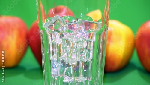 apple juice pouring into a glass slow motion 4k chroma key photo