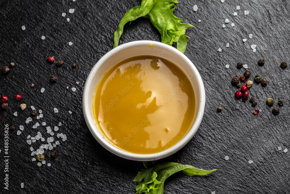 Fresh homemade organic mustard and honey sauce on a dark background, Food recipe background. Close up Fresh homemade organic mustard and honey sauce on a dark background, Food recipe background. Close up