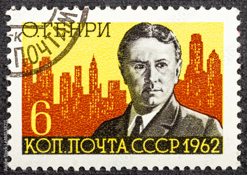 USSR - CIRCA 1962: A stamp printed in USSR shows O. Henry and New York Skyline William Sidney Porter, 1862-1910 , American writer, circa 1962 © Vladimir