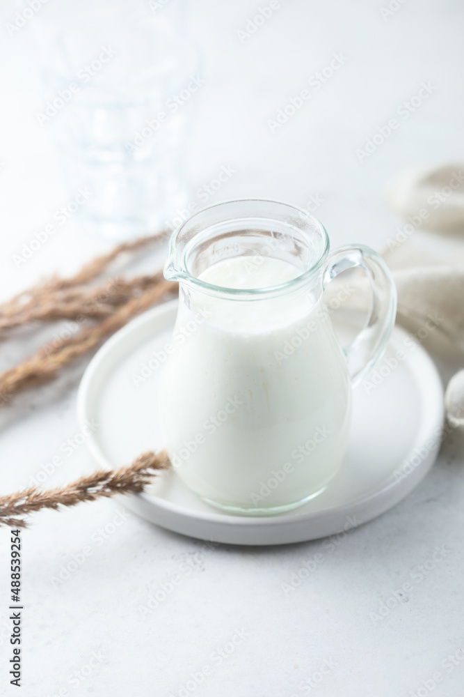 Fresh dairy product in a jug Fresh dairy product in a jug