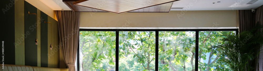 clean black frame large window with green parasol trees summer forest view background banner clean black frame large window with green parasol trees summer forest view background banner