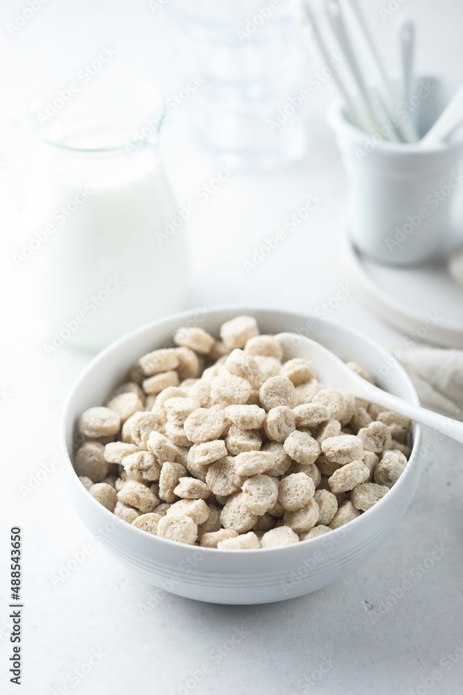 Healthy organic bran in a white bowl Healthy organic bran in a white bowl