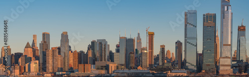 Manhattan skyline panoramic view, perfect for web design banner, during clear sky day right before sunset. © Stock fresh 