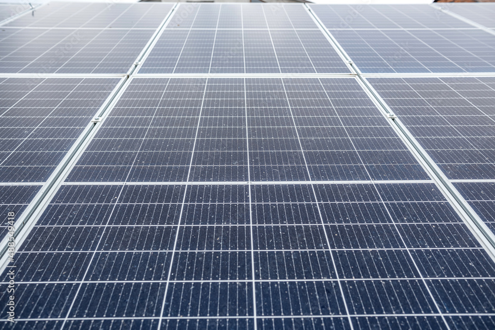 economical newly installed shiny solar panels that sparkle under the sky and the sun's rays. economical newly installed shiny solar panels that sparkle under the sky and the sun's rays.