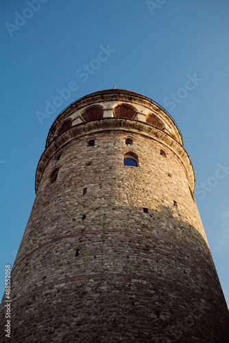 Galata tower, the castle with a historical Istanbul image, a shot of architecture from below and a blue sky, Istanbul,Turkiye,01-30-2022