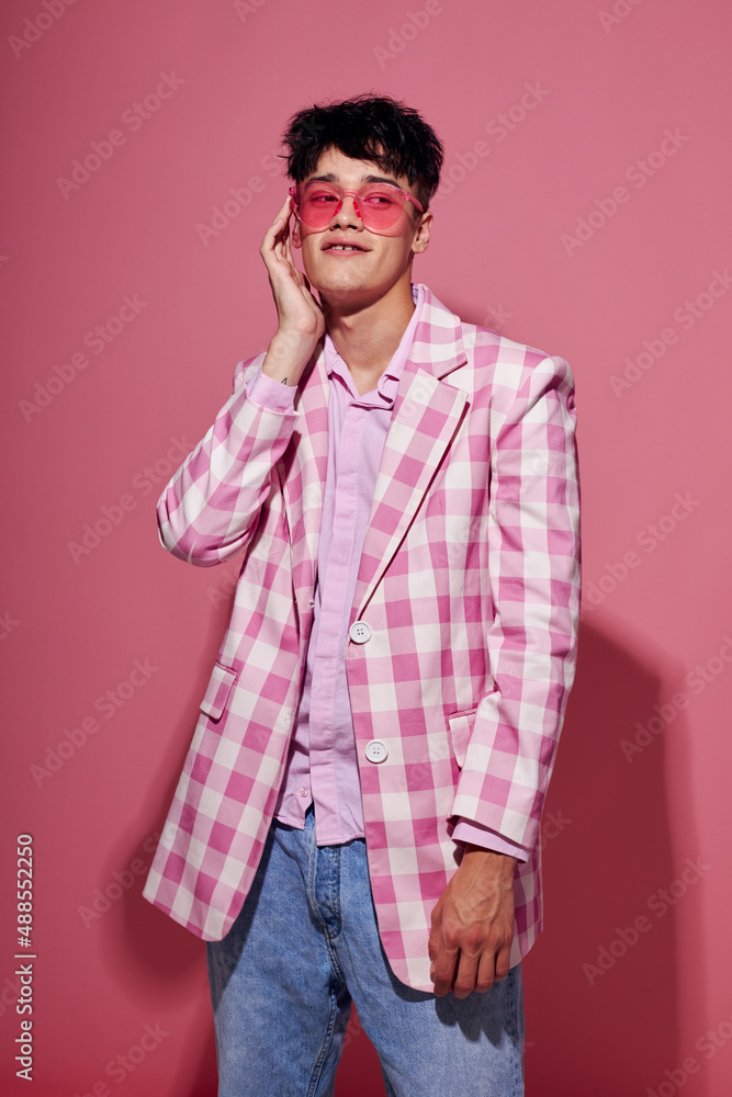 Fototapeta premium Photo of romantic young boyfriend pink shirt and glasses jacket fashion elegant style model studio