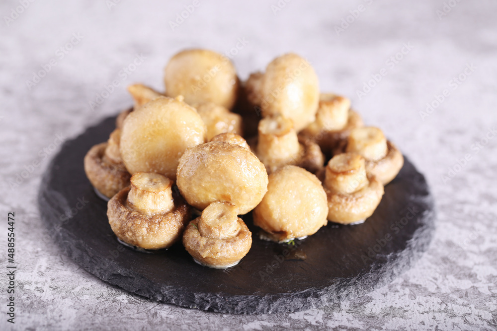 mushrooms and champignons baked in the oven with butter mushrooms and champignons baked in the oven with butter
