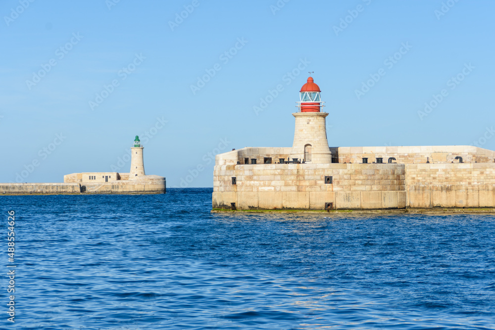 At the entrance to the Grand Harbour in Malta are two lighthouses one on each of the Valletta and Ricasoli Breakwaters.