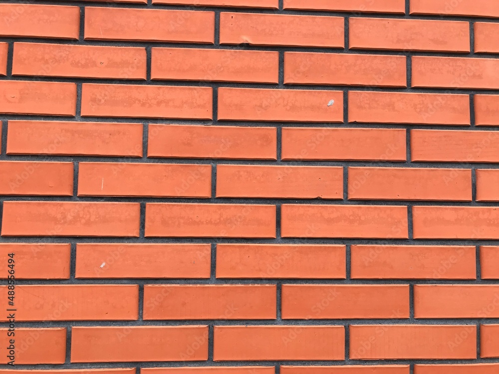 Orange brick wall. Wall ornament for background. Orange brick wall. Wall ornament for background.