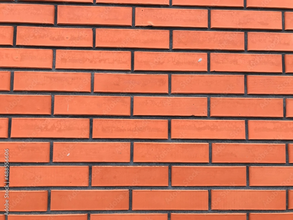 Orange brick wall. Wall ornament for background. Orange brick wall. Wall ornament for background.
