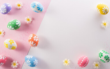 Happy easter decoration concept. Colourful Easter eggs with flowers on pink and white background.