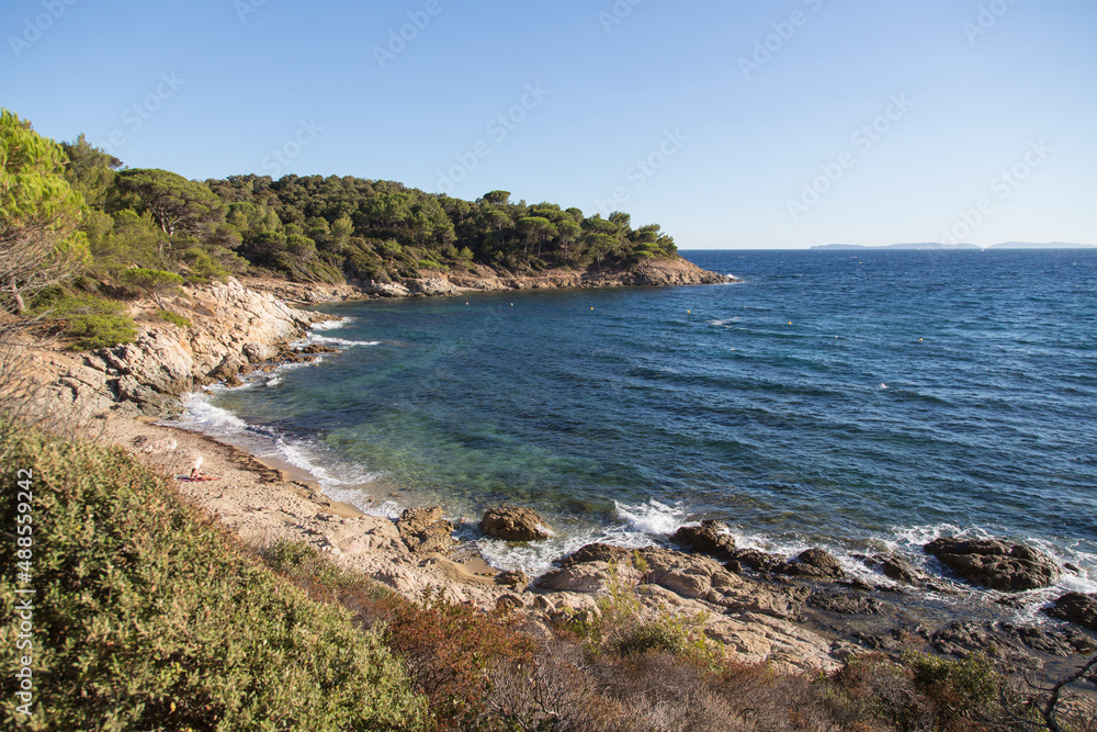Hidden small bay with a rocky and sandy beach and a breathtaking view to the mediterranean under pines - hiking trail Sentier du Littoral in the beautiful nature reserve at the peninsula Saint Tropez