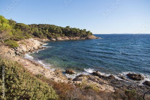 Hidden small bay with a rocky and sandy beach and a breathtaking view to the mediterranean under pines - hiking trail Sentier du Littoral in the beautiful nature reserve at the peninsula Saint Tropez