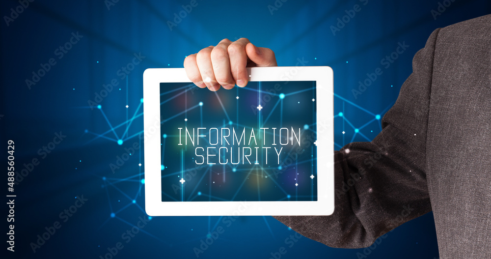 Person holding tablet, security concept Person holding tablet, security concept