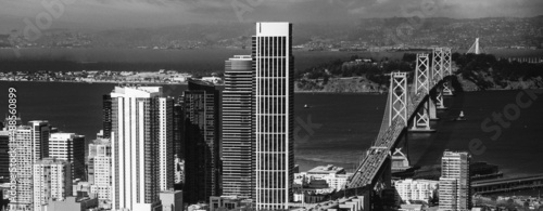 Photography Aerial view of San Francisco road to Bay Bridge and city skyline from helicopter