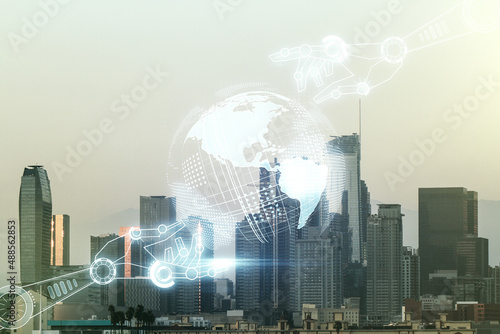 Double exposure of abstract virtual robotics technology with world map hologram on Los Angeles city skyscrapers background. Research and development software concept