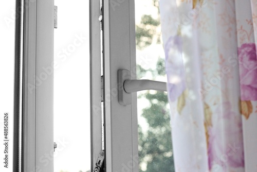 Open white plastic window. Close up. Isolated on white background © OB production